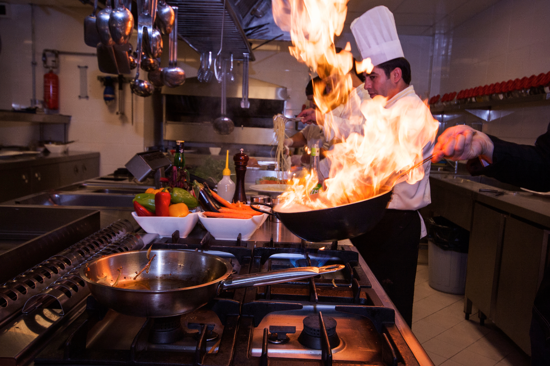 Chef cooking with flames